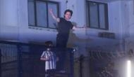 Shah Rukh Khan greets fans with his 'signature pose' on his 57th birthday