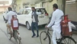 Gujarat polls: Congress MLA carries 'gas cylinder' on his bicycle to cast vote