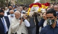 PM Modi carries mortal remains of mother, pays floral tribute