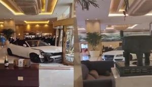 Angry guest rams car through hotel's glass door, drives wildly around lobby [WATCH]