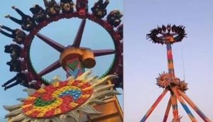 Viral Video: Tourists hang upside down on broken amusement park ride