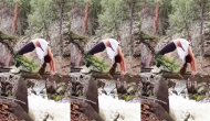 Woman tries yoga on narrow tree trunk above raging river, guess what happens next [WATCH]