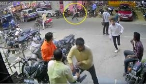 Watch: Man slits his throat in Delhi, runs on busy road with knife, pistol