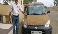 MP: Homeopathic doctor coats his car with cow dung to get relief from heat in Sagar