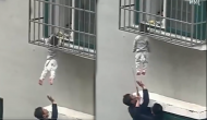 Caught on Camera: Real-life heroes save child stuck in balcony window