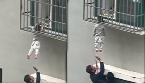 Caught on Camera: Real-life heroes save child stuck in balcony window