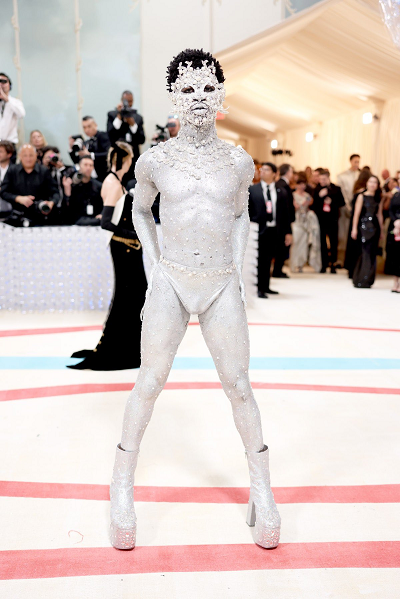 Lil Nas X covers body in silver paint, rhinestones for 2023 Met Gala