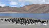 Indian Army personnel perform Yoga at Ladakh's Pangong Tso Lake