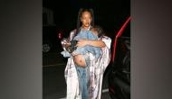 Pregnant Rihanna shows off baby bump at dinner with son RZA