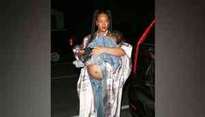 Pregnant Rihanna shows off baby bump at dinner with son RZA