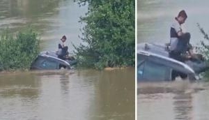 Dramatic Rescue in Odisha: Two men saved as car gets stranded on flooded road