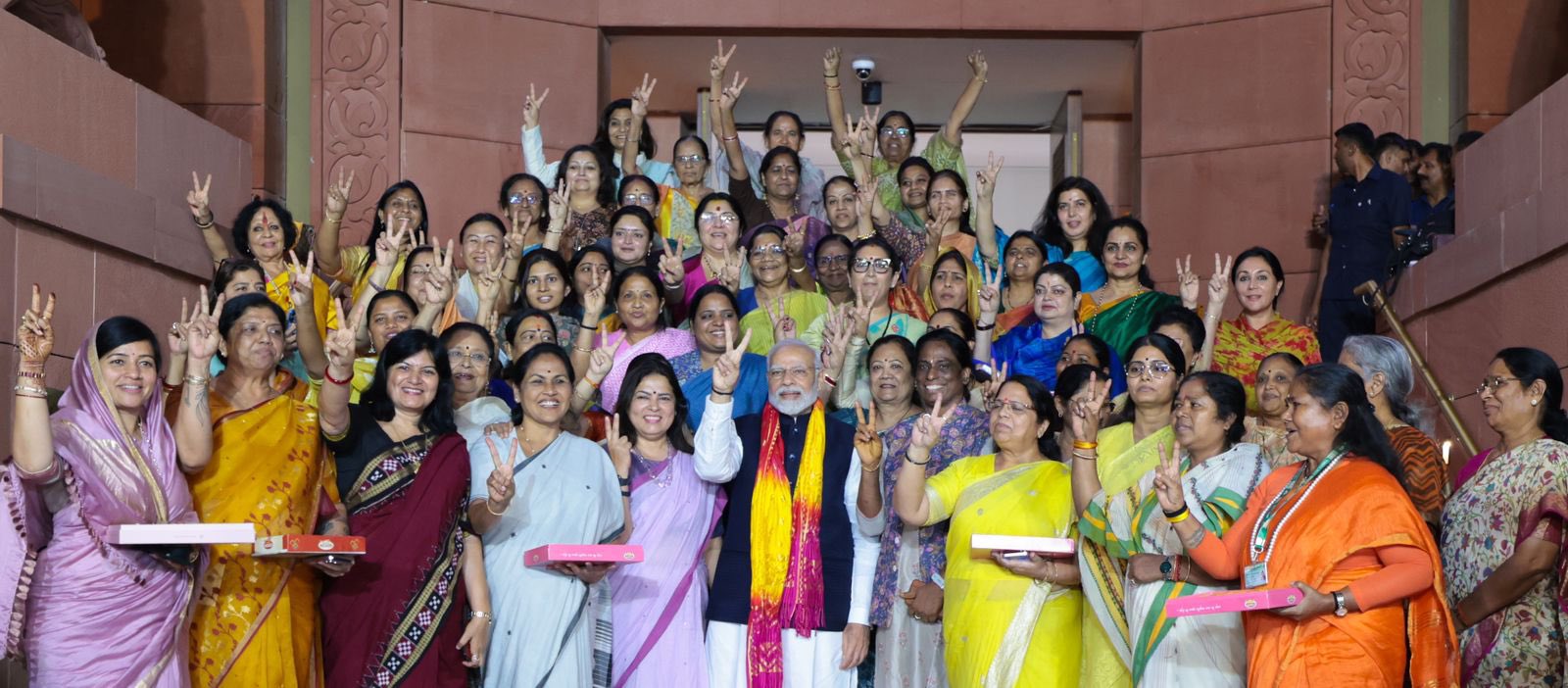 Women members chant PM Modi’s name, present bouquet to him after historic passage of women’s quota Bill in Parliament
