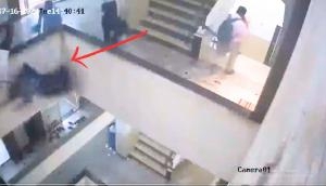 Woman Falls to Death After Playful Interaction with Colleague on Staircase Wall