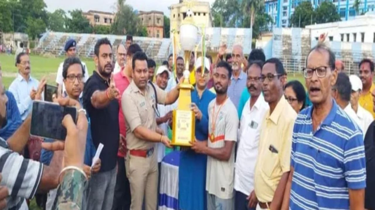 Football Tournament Winners Receive Trophy