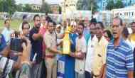 Football Tournament Winners Receive Trophy