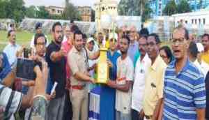 Football Tournament Winners Receive Trophy