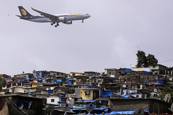 Slums_Plane_Dhiraj Singh/Bloomberg via Getty Images