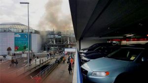 Brussels terror attack: Islamic State warns of more deadly attacks; investigators hunting for 'man in hat' 