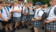 Teenage boys arrive at school in skirts to protest against 'no shorts' policy