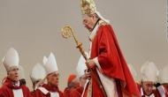 Cardinal George Pell vows to return to Australia to defend himself