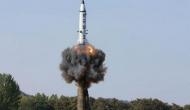 North Korea test-fires ballistic missile which flies over Japan