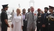 In Photos: Prince Charles and Camilla greeted with the capital's smog