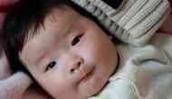 A Chinese baby born four-year after his parents died in a car accident