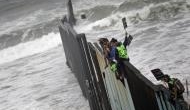 As US-Mexico border crossing shuts, asylum seekers climb 'the wall' in desperation 