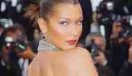 Bella Hadid posts nude beach photo on Instagram, with g-string and oversized straw hat
