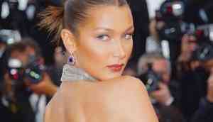 Bella Hadid posts nude beach photo on Instagram, with g-string and oversized straw hat