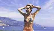 Bikini-clad actress Bella Thorne displays her armpit hair on the beach in Hawaii