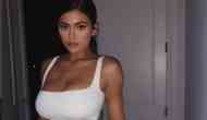 Kylie Jenner wears bra out to dinner, with Alexander Wang Leggings and Yeezy Mules