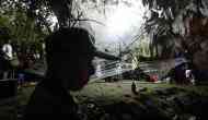 Crying parents gather outside cave where 12 young football players are trapped
