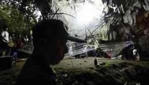 Crying parents gather outside cave where 12 young football players are trapped