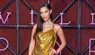 Bella Hadid stuns in a sexy gold Versace dress at Bulgari dinner in Rome