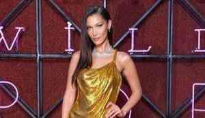 Bella Hadid stuns in a sexy gold Versace dress at Bulgari dinner in Rome