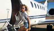 Rita Ora poses in sexy mini dress and boots as she travels by private jet