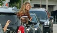 Woman flashes her breast at David Beckham out of her car window in Miami