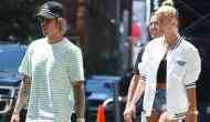 Hailey Baldwin flaunts her oval diamond engagement ring with Justin Bieber in NYC