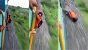 Video: When young man's stunt in a moving train went wrong and hits the ground hard; sparks rage online