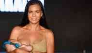 Swimsuit model Mara Martin breastfeeds her daughter while walking Sports Illustrated Swimsuit Runway