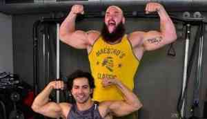 Bollywood actor Varun Dhawan flex muscle with WWE superstar Braun Strowman 