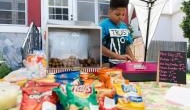 Watch how police and health dept come together to help a US boy keep his hot-dog stand