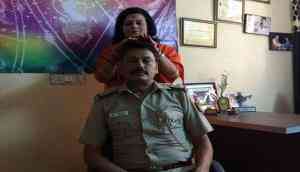 Shocking! Delhi police SHO faces transfer after his photo of'healing session' with godwoman in uniform go viral; see pic