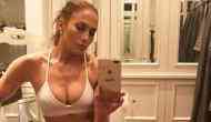 Jennifer Lopez flaunts her perfect abs in sexy black bikini at the beach for her 49th birthday