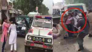 Watch Video: Allahabad University's girls blocks BJP chief Amit Shah's convoy; cops pulls their hair and beat them with stick