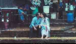 Couple kissing in rain