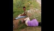 Watch Video: OMG! Drunk Telangana youth peals alive chicken's carcass and eat it, passerby filmed the act