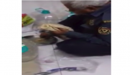 Video of Elderly security guard eat 'roti' and gulps it with water goes viral; this will surely leave you teary eyed