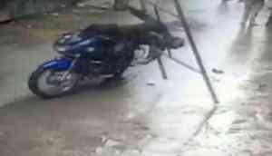 Bengaluru: CCTV footage captures how a biker escaped death as iron frame falls on him; see video